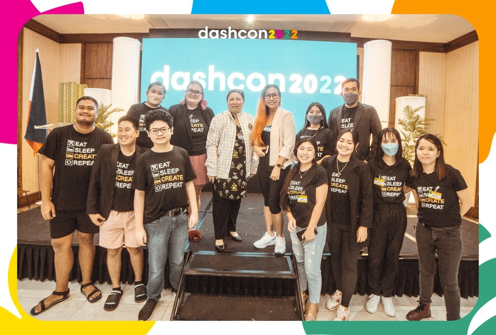 The DashCon 2022 organising team on stage in branded shirts